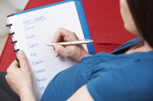 Pregnant Mother Choosing Name For Unborn Baby Girl