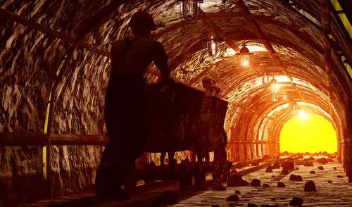 Workers pushing the cart in the mine.