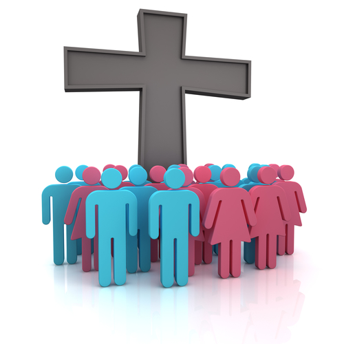 Group of the people standing at a christian cross